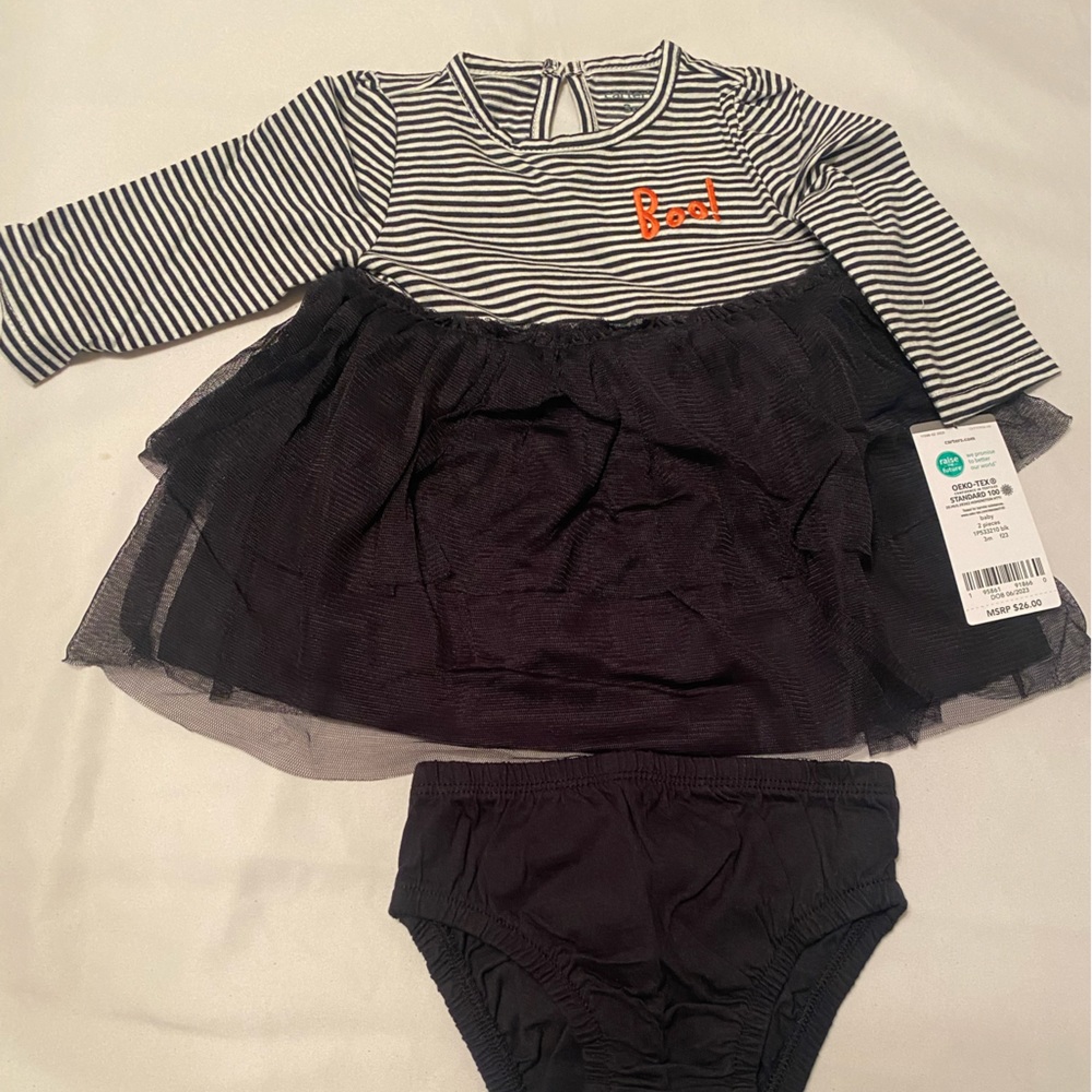 Baby girl’s Halloween outfit with attached tutu